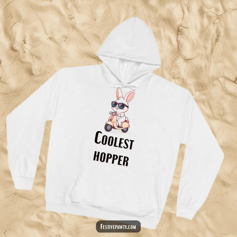 Funny Hoodie featuring a cheerful bunny in sunglasses, happily riding a tiny scooter, perfect for staying warm with a cool vibe.