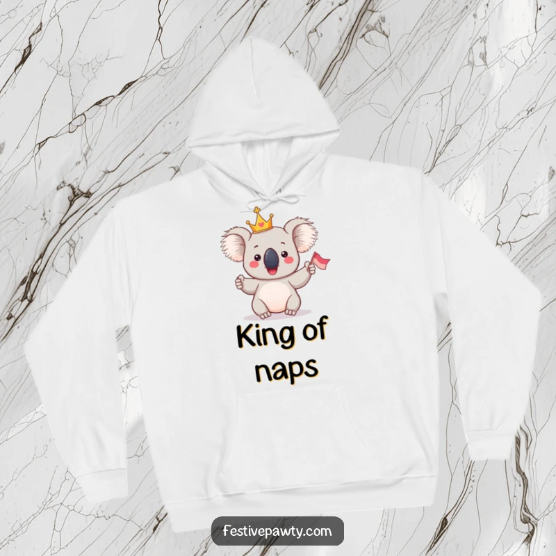 Funny Koala King Hoodie: A giddy koala wearing a tiny crown, enthusiastically waving a flag, perfect for cozy, regal lounging.