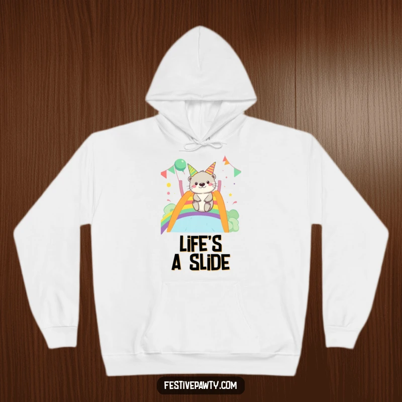 Funny Otter Hoodie: A merry otter is depicted mid-slide down a vibrant rainbow, radiating pure, fun-loving energy.